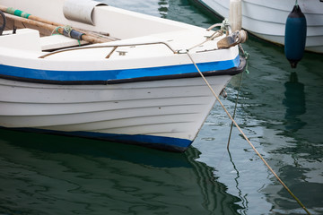 Fototapeta na wymiar Boat at the Mediterranean sea port