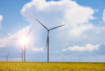 Wind power station at the yellow field