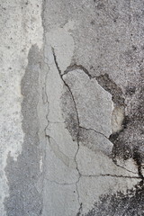 cracked grey concrete wall