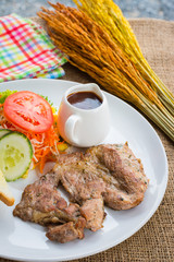Beef steak with black pepper sauce , salad and French fries on s