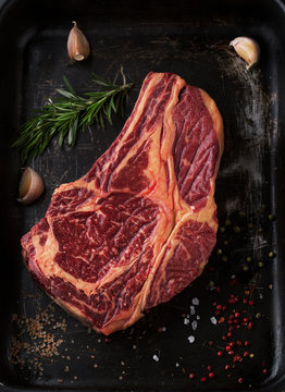 Raw fresh meat Ribeye Steak with  pepper and salt
