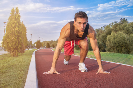 Handsome Athletic Man in Running Start Position