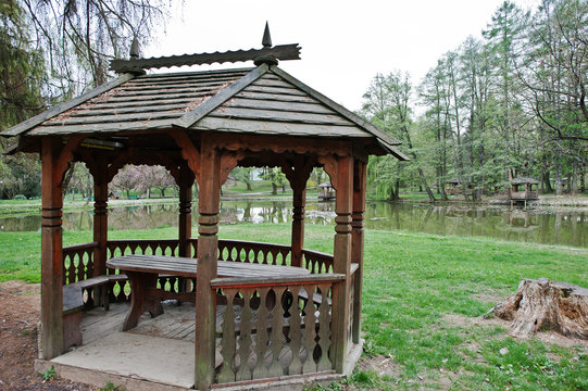 Wooden garden house pavilion at park