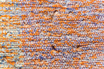 texture of woven cotton orange, white, blue yarn