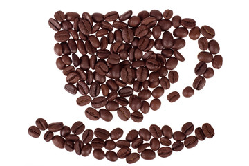 Roasted coffee beans placed in the shape of a cup and saucer on a white surface. Isolated on white background.