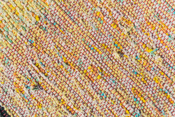texture of woven cotton red, pink, white, yellow threads