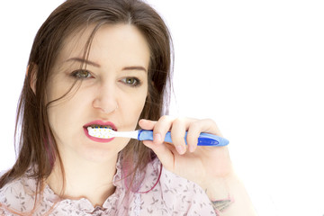 pretty lady brushing teeth