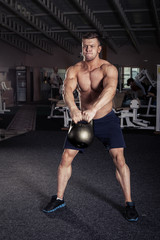 Fototapeta na wymiar Fitness Kettlebells swing exercise man workout