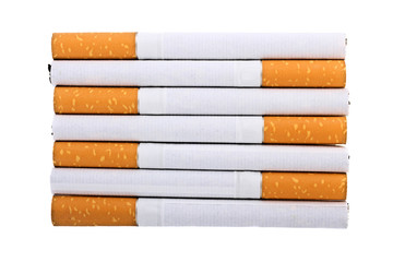 Cigarette with an orange filter lie close to each other isolated on white background
