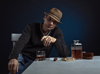 man with whiskey and cigar