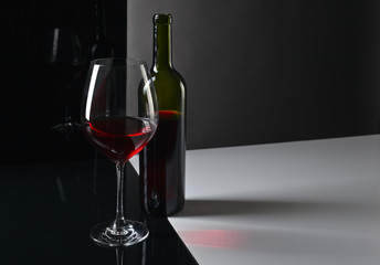  bottle and glass with red wine
