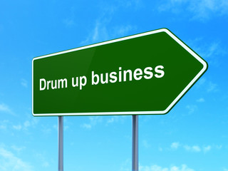 Finance concept: Drum up business on road sign background