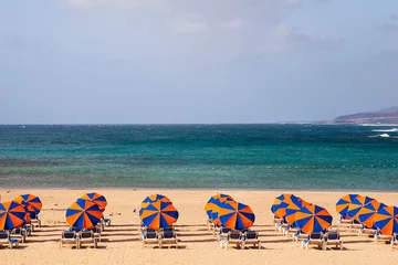 Foto op Aluminium umbrellas on beach, Fuerteventura, Canary Islands. © elitravo