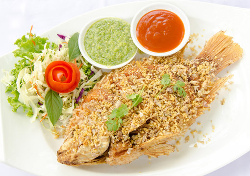 Deep Fried Red Tilapia with Garlic and Pepper, Thai food.