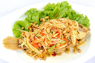Deep fried red tilapia with papaya salad, Thai traditional food.