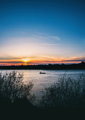 Fisherman's boat at beautiful sunset on the river