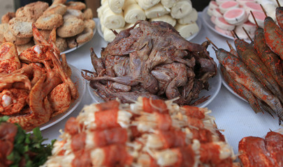 Street food in Sapa, typical style of dining on street side in Vietnam. Focus on the center.