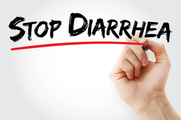Hand writing Stop Diarrhea with marker, health concept background