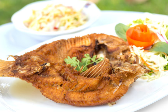 Deep fried red tilapia with fish sauce, Thai food.