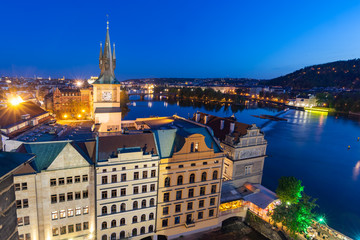 Fototapeta premium Old Town Water Tower - Staromestska Vodarna in Prague, Czech Republic. Vltava river at night