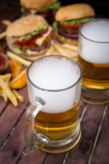 Closeup of homemade burgers and beer
