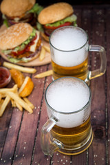 Closeup of homemade burgers and beer
