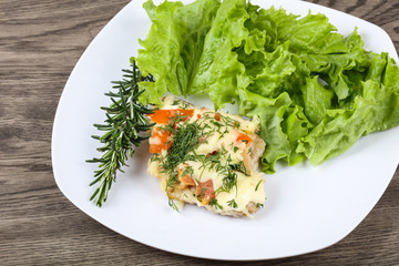 Meat covered cheese and tomato