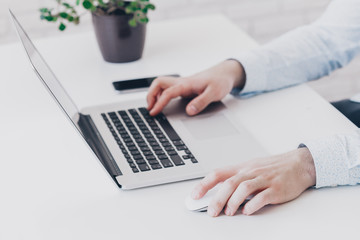 Businessman at work. Close-up top view of man working on laptop