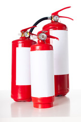 Obraz premium Three fire extinguisher isolated on white background