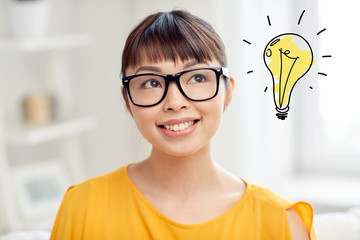 asian woman in glasses with light bulb doodle