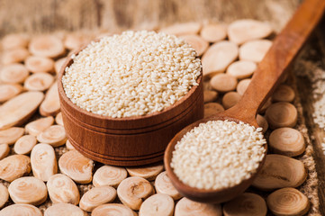 seeds  sesame on wooden spoon