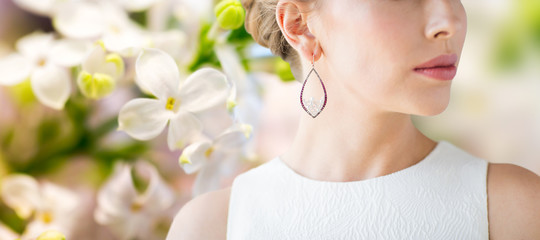 close up of beautiful woman face with earring