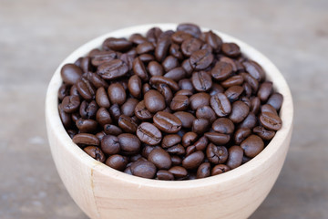 Coffee beans in wooden bowl
