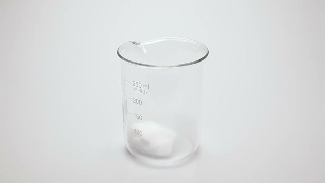 Pouring red liquid in glass with dry ice. Steaming red liquid.