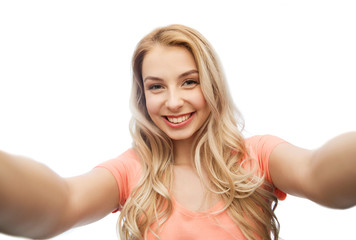 Obraz premium happy smiling young woman taking selfie