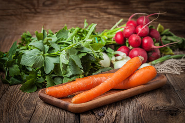 Fresh vegetables on a wooden table.