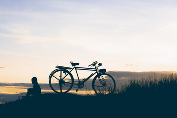 Fototapeta premium little boy sitting with bike