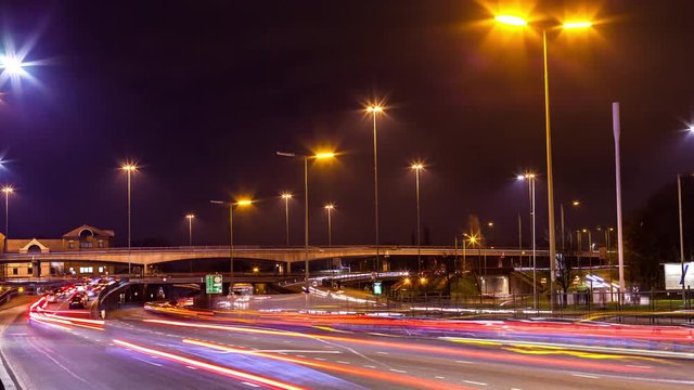 Traffic time lapse of a cross road, flyover in London at night with long shutter.
Brent Cross Flyover in London at night.