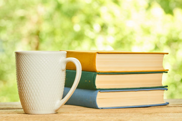 Cup and stack of books