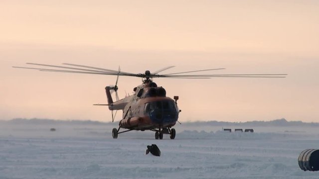 Take off the helicopter with ice airfield. ICE CAMP BARNEO, ARCTIC - APRIL, 2010:  Drift station on frozen Ocean near North Pole. With its integrated ice runway, caters for air borne tourist industry.
