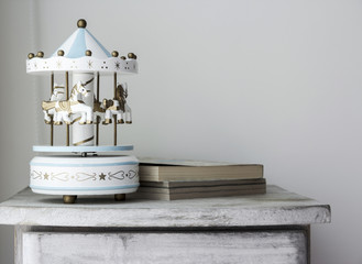 Carousel horse on vintage cabinet