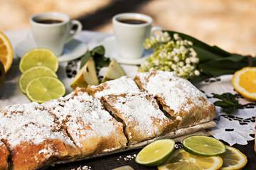 pie, strudel with pear and lemon. Cup of coffee. .Picnic, Breakfast in nature. Food in nature.