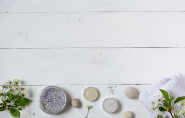 Spa background of oil, towel and candles.Top view