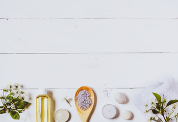 Spa background of oil, towel and candles.Top view