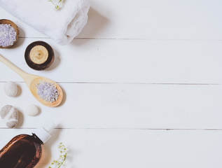 Spa background of oil, towel and candles.Top view