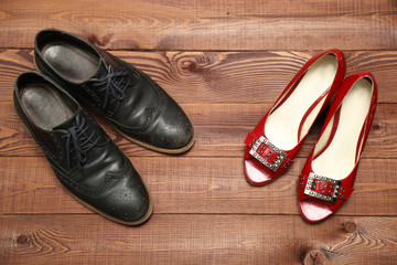 Classic style man and woman shoes on wooden background