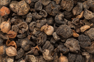 Organic dried Indian gooseberry (Phyllanthus emblica) with whole seeds. Macro close up background texture. Top view.