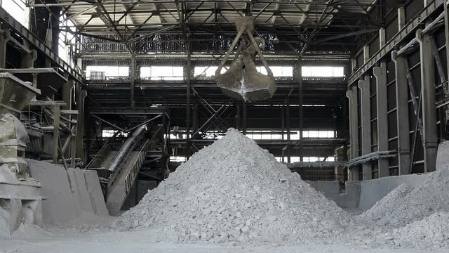 Sulphate manufacture storage. Clamshell crane.