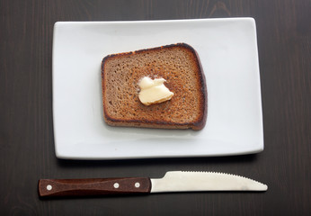 Toasted rye bread on the white plate