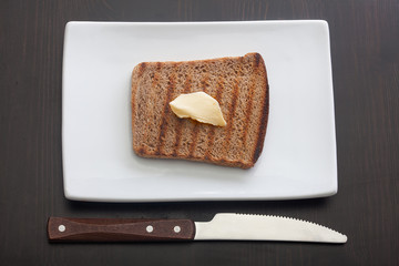 Toasted rye bread on the white plate